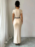 A Figure-Hugging Pleated And Waist-Cinching Dress
