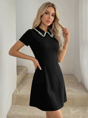 Classic Pearl-Detailed Black Mini Dress