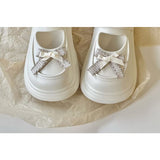 Mary-Jane-Clogs mit Plateausohle und Schleife