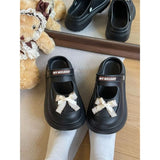 Mary-Jane-Clogs mit Plateausohle und Schleife