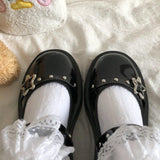 Mary-Jane-Schuhe mit Plateau-Keilabsatz und Sternschnalle