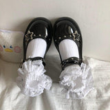 Mary-Jane-Schuhe mit Plateau-Keilabsatz und Sternschnalle